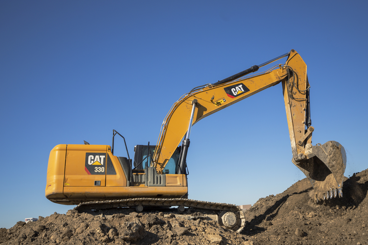 Excavator working residential site